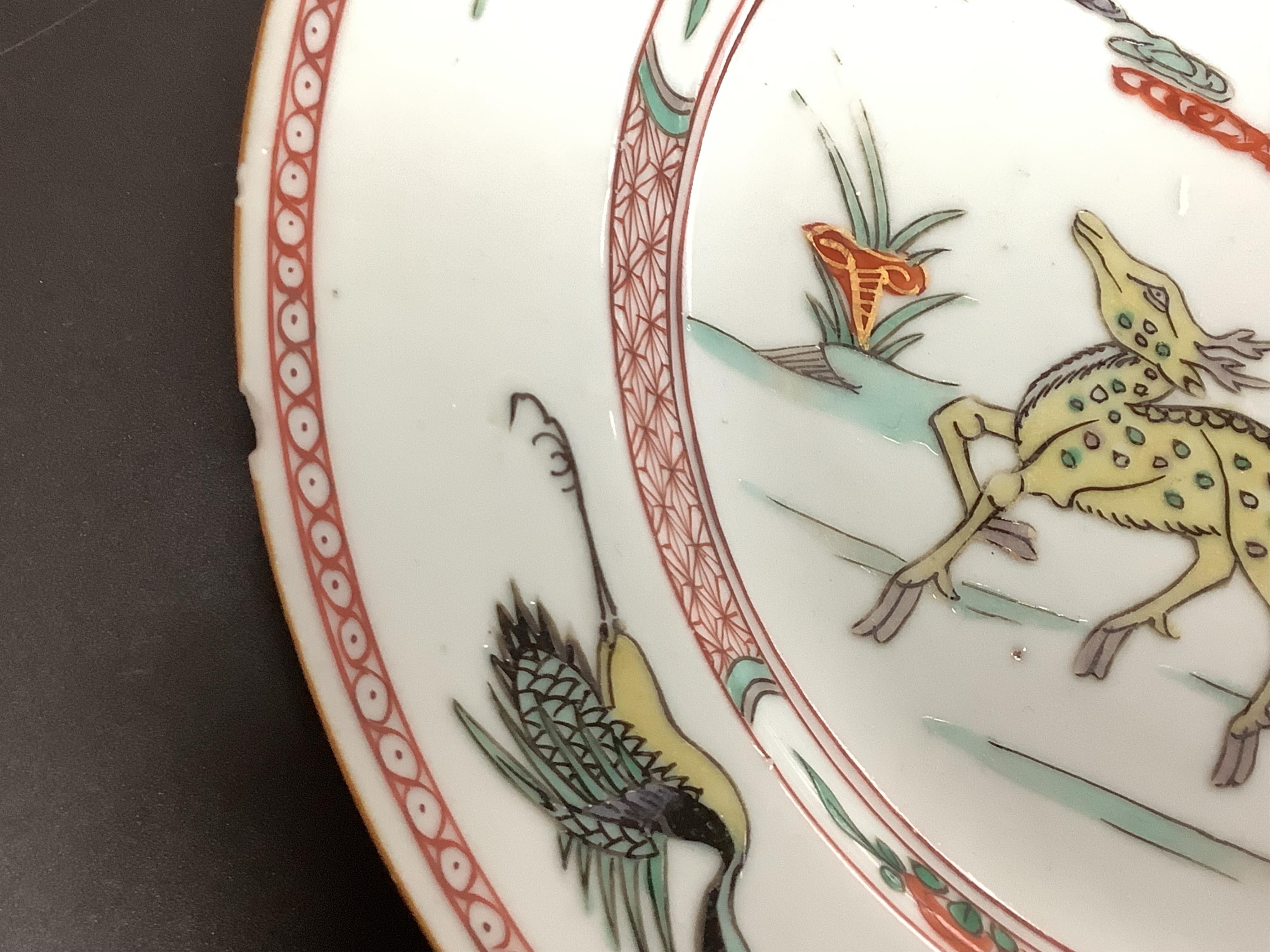 Three Chinese famille verte deer and crane plates, Kangxi period, 22cm in diameter